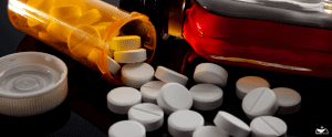 HHRC-Opioid epidemic, drug abuse and dangerous mixing of barbiturates and alcohol concept with oxycodone pills fallen out